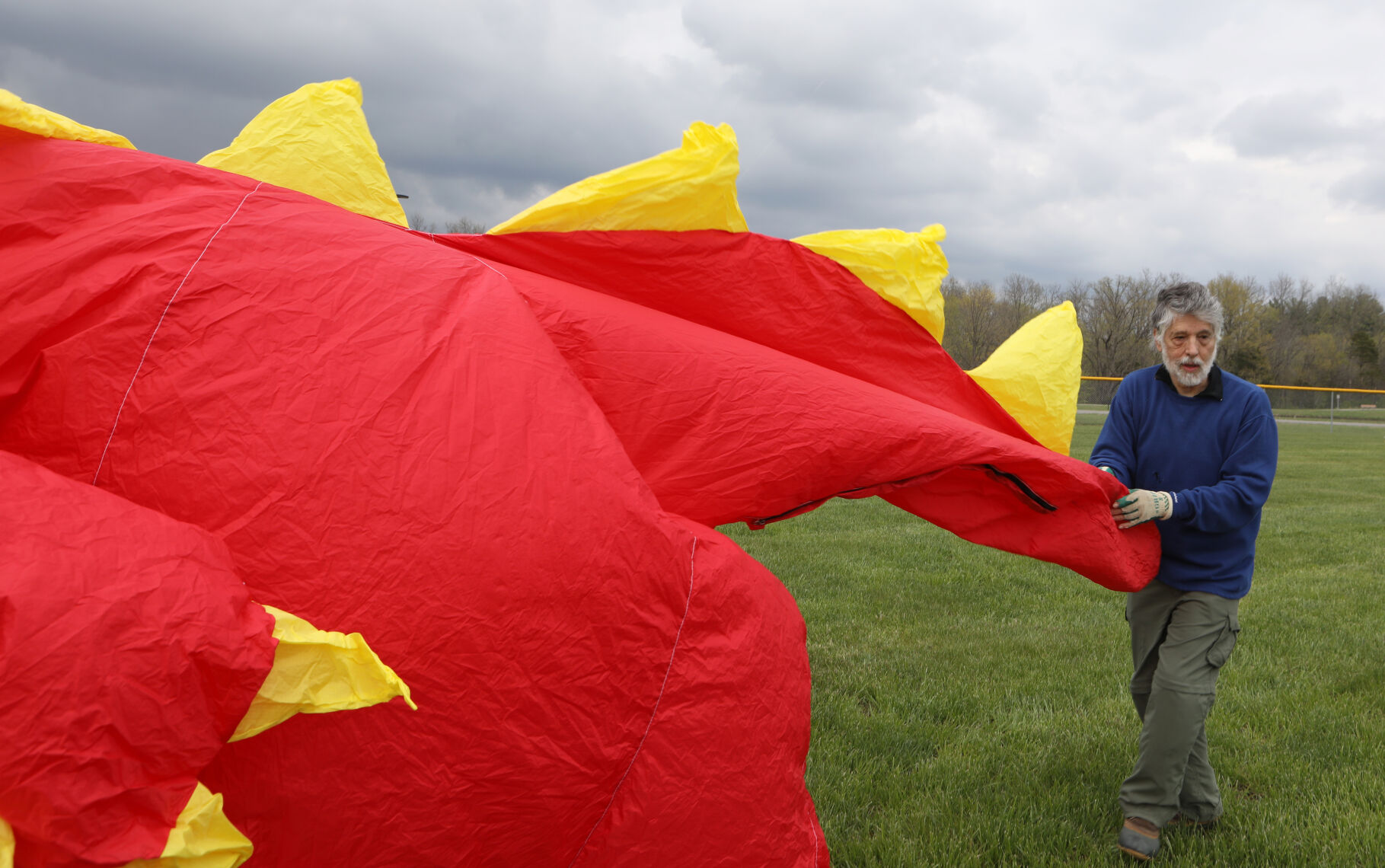 Mitch Cordover helps a dragon kite off the ground